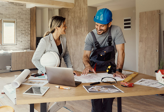 Homeowner working with contractor in house