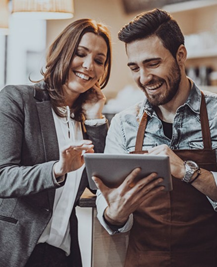 Business professionals looking at a tablet