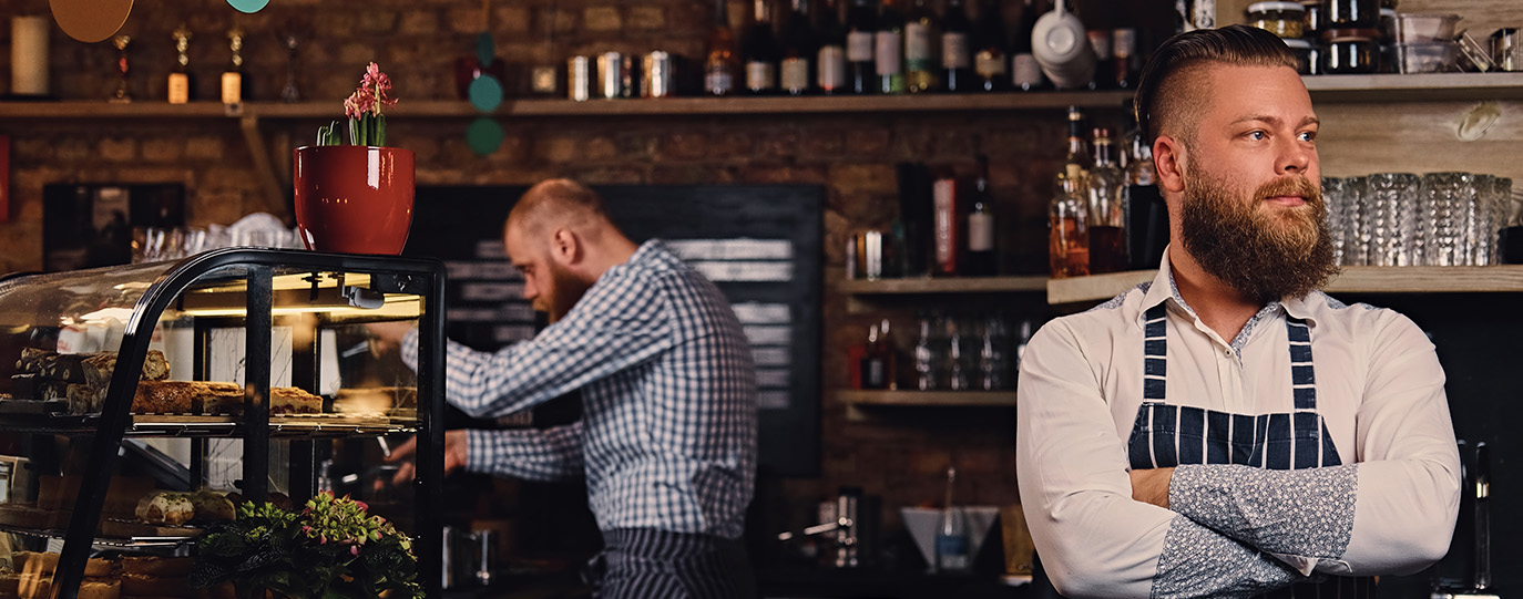 Male barista looking into the distance