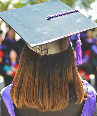Back view of woman graduating